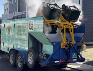 Charlottesville Bin Cleaners cleaning a residential garbage bin in Charlottesville, Virginia, using high-pressure and 200-degree heat to remove grime, odor and bacteria.